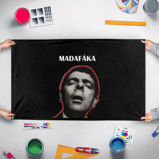 A mockup of the custom flag 'dada flag' held up on a table during print checking