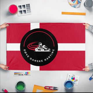 A mockup of the custom flag 'ddk flag' held up on a table during print checking