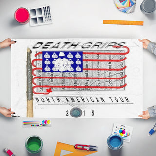 A mockup of the custom flag 'deathgrips flag' held up on a table during print checking