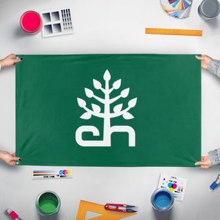 A mockup of the custom flag 'heights flag' held up on a table during print checking