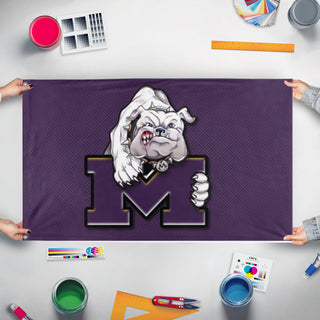 A mockup of the custom flag 'midland high flag' held up on a table during print checking