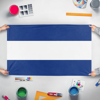 A mockup of the custom flag 'nicaragua flag' held up on a table during print checking