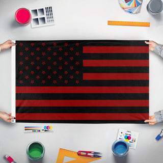 A mockup of the custom flag 'penta flag' held up on a table during print checking