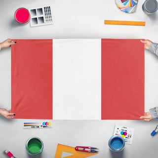 A mockup of the custom flag 'peru flag' held up on a table during print checking