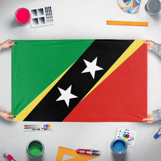 A mockup of the custom flag 'san cristobal y nieves flag' held up on a table during print checking