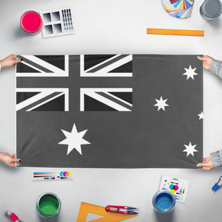 A mockup of the custom flag 'test flag' held up on a table during print checking