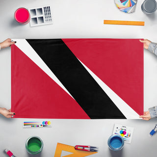 A mockup of the custom flag 'trinidad/tobago flag' held up on a table during print checking