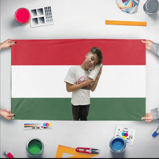 A mockup of the custom flag 'tuzaria flag' held up on a table during print checking