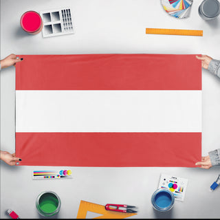 A mockup of the custom flag 'undefined flag' held up on a table during print checking