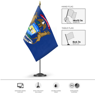 A mockup of the custom flag 'Michigan State Flag' as a desk flag and small hand waving flag