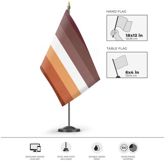 A mockup of the custom flag 'stud lesbian flag' as a desk flag and small hand waving flag