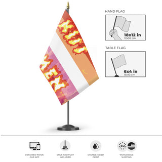 A mockup of the custom flag 'aggressive lesbian flag' as a desk flag and small hand waving flag
