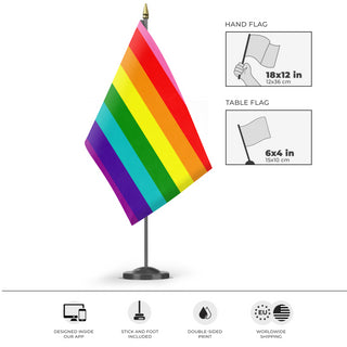 A mockup of the custom flag 'Original 8 Stripe Gilbert Baker Rainbow Pride Flag' as a desk flag and small hand waving flag