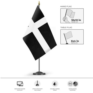 A mockup of the custom flag 'Cornwall Flag' as a desk flag and small hand waving flag
