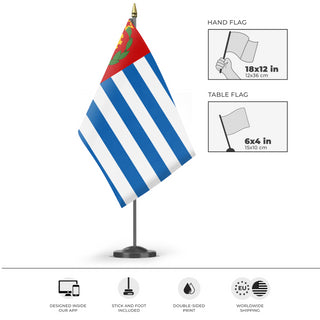 A mockup of the custom flag 'Socialist Greece Flag' as a desk flag and small hand waving flag
