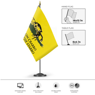 A mockup of the custom flag 'Crab Gadsden Flag' as a desk flag and small hand waving flag