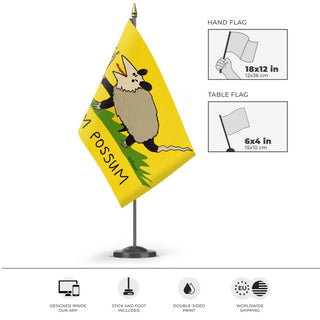 A mockup of the custom flag 'No Crossum The Possum Flag' as a desk flag and small hand waving flag