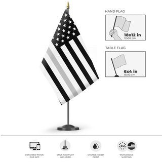 A mockup of the custom flag 'Thin Silver Line Flag' as a desk flag and small hand waving flag