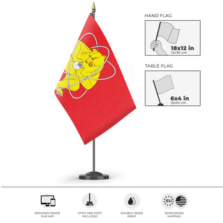 A mockup of the custom flag 'Zheleznogorsk, Krasnoyarsk Krai flag' as a desk flag and small hand waving flag