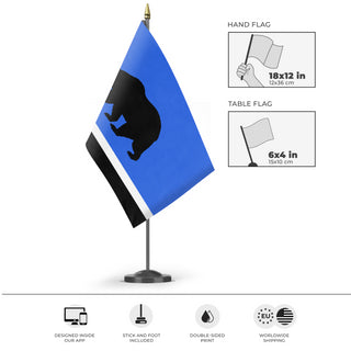 A mockup of the custom flag 'Republic of Monterey Bay flag' as a desk flag and small hand waving flag