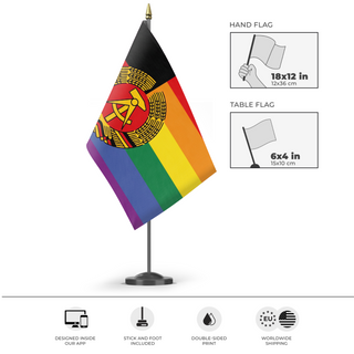 A mockup of the custom flag 'East Germany Pride flag' as a desk flag and small hand waving flag