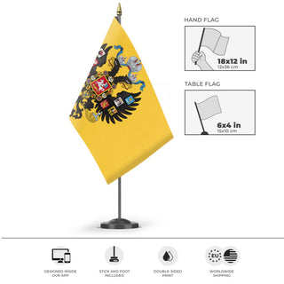 A mockup of the custom flag 'Russian Empire flag' as a desk flag and small hand waving flag